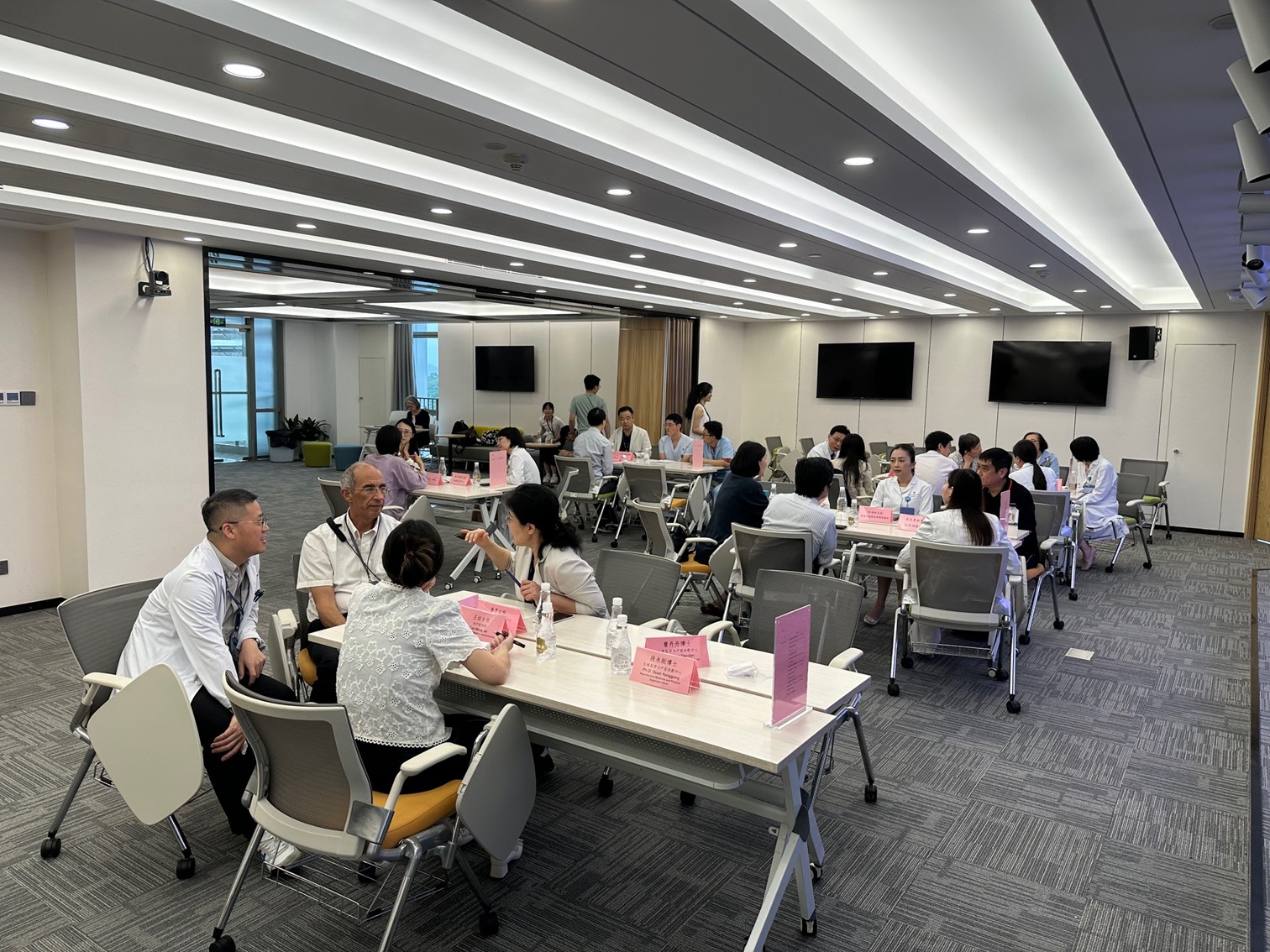 Participants engage in parallel discussion sessions focusing on various public health topics.